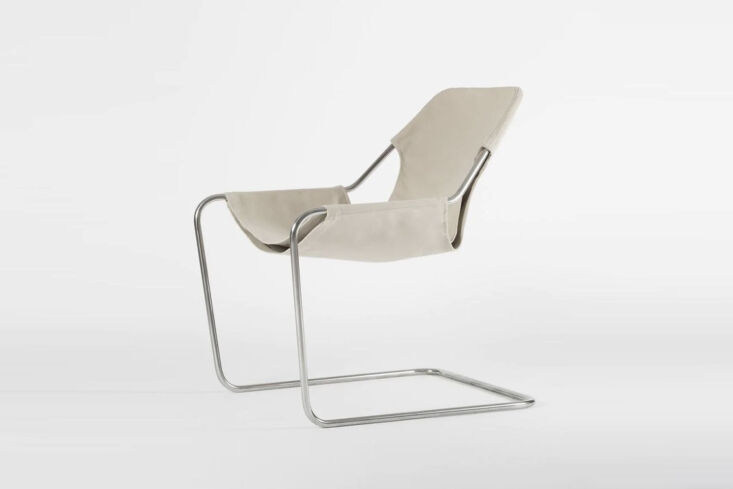 A Paulistano Canvas Chair featuring a single bended steel bar frame and canvas sling.
