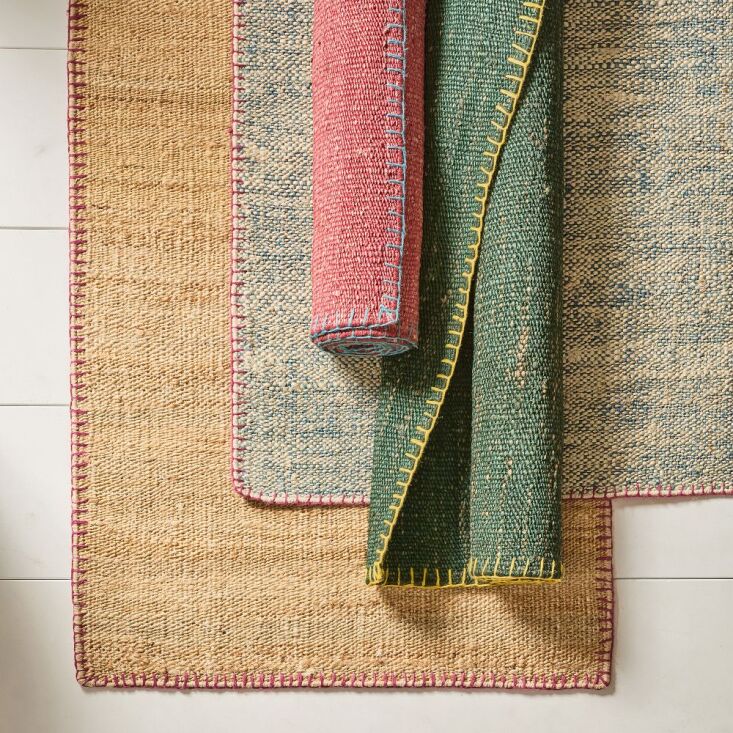 Close-up of a handwoven jute rug with whipstitch edge detailing.