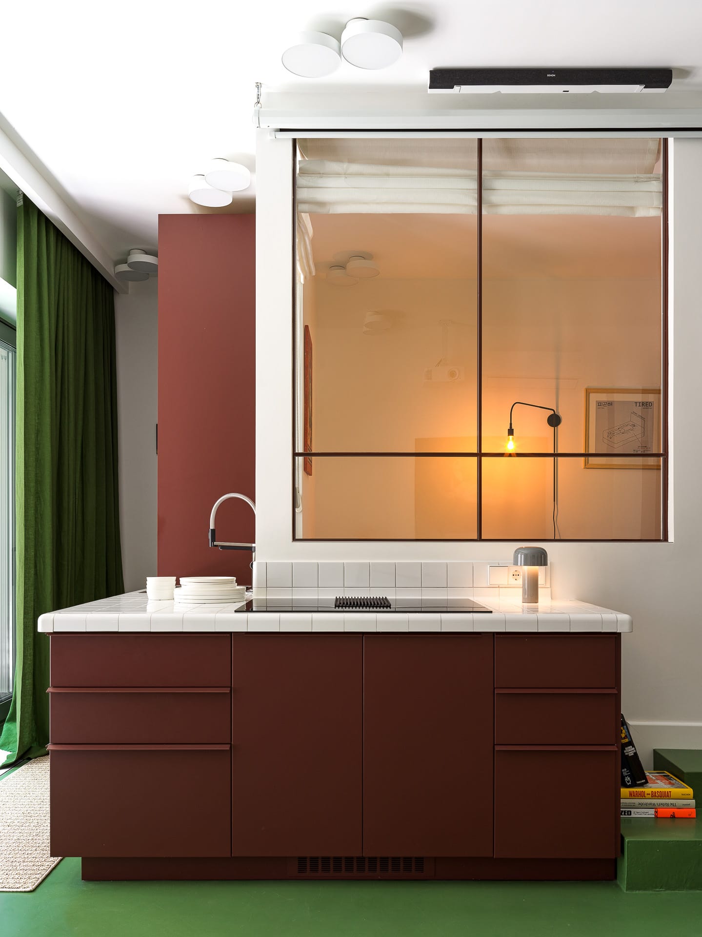 A living space showing distinct zones for relaxation and dining without physical barriers.