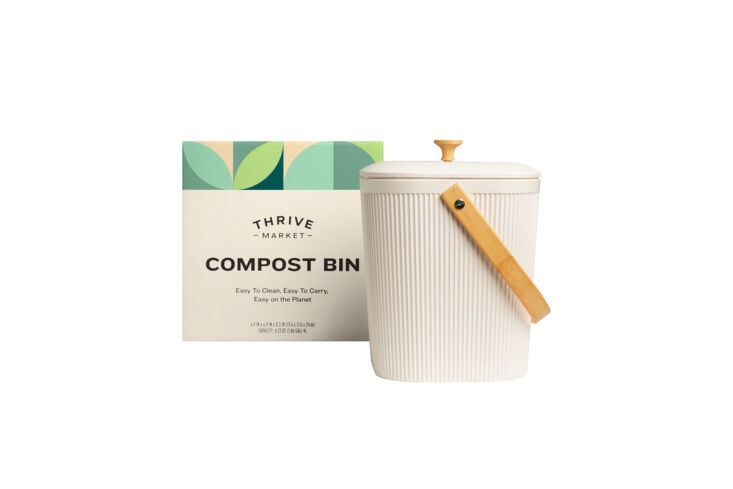 A stainless steel compost bin featuring a built-in charcoal filter in the lid.