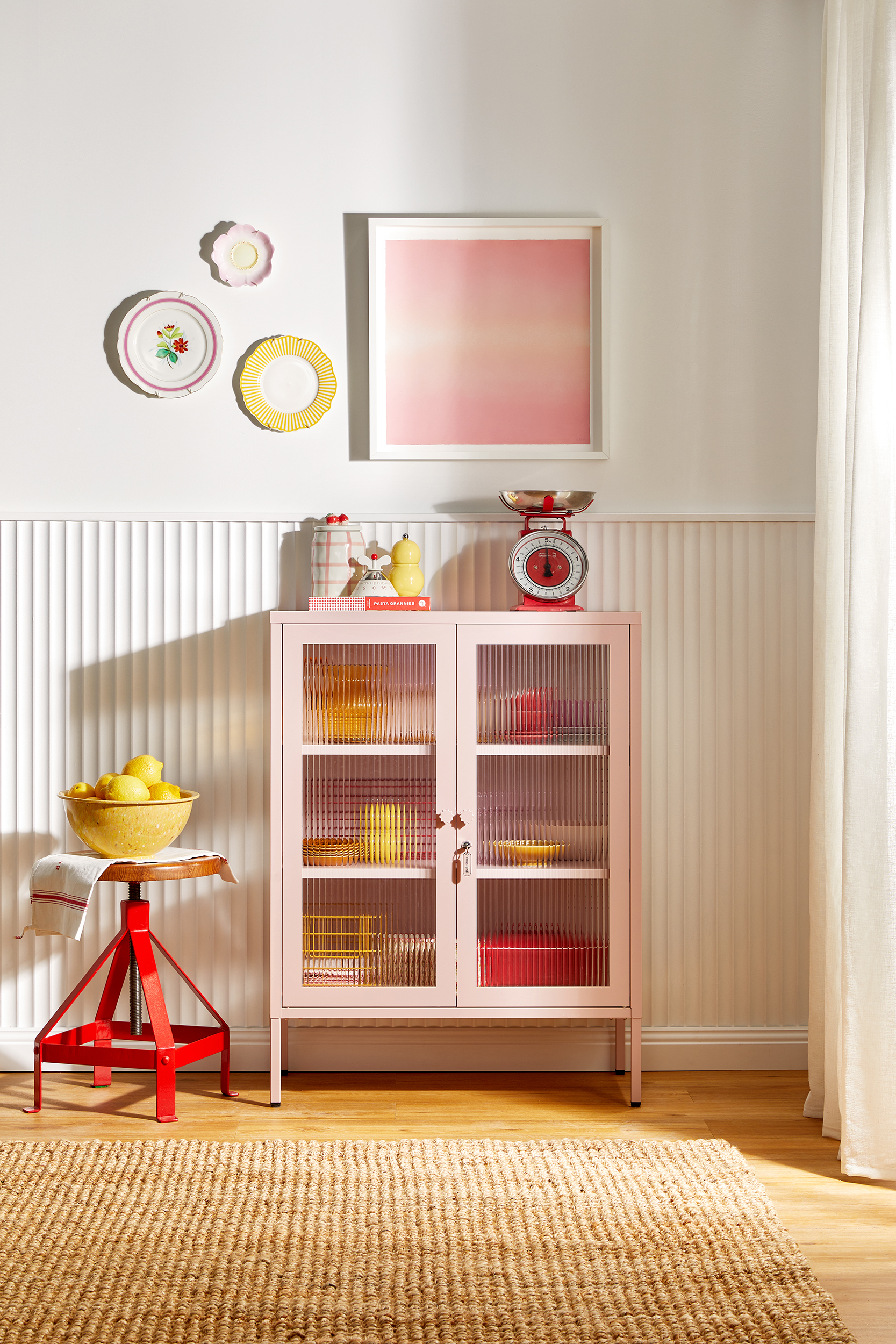 The Mixer cabinet in Blush pink used as a stylish drinks and glassware cabinet.