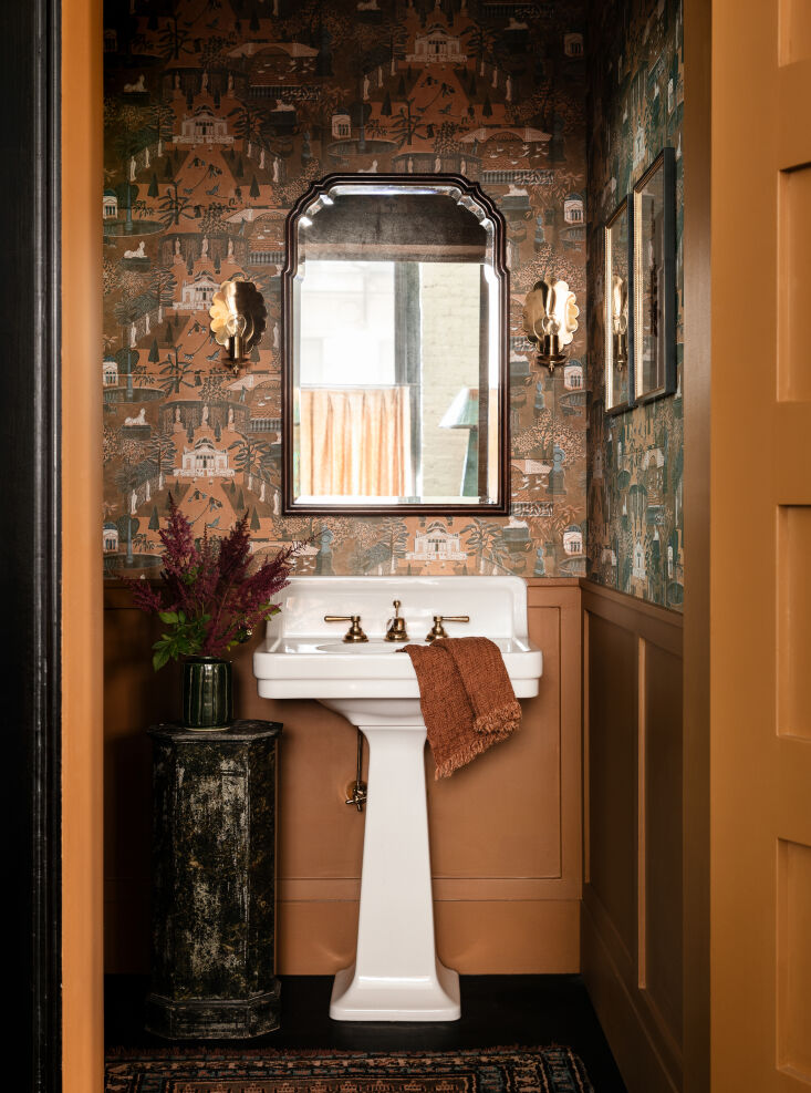 A pair of Nickey Kehoe sconces installed in a small designer powder room in a downtown NYC loft.