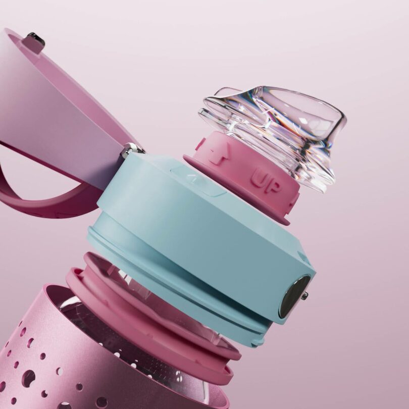 Close-up of a pastel-colored water bottle with a transparent cap and modular pink and blue components.