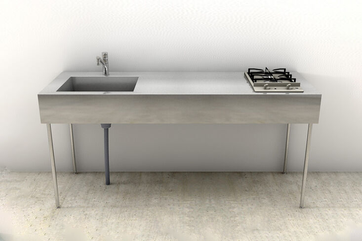 Minimalist Japanese-style kitchen island with thin legs and a stainless steel sink.
