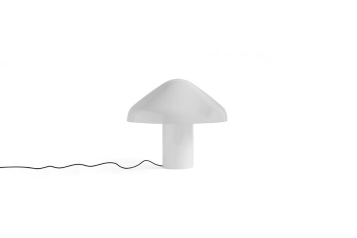 A HAY Pao Glass LED Table Lamp providing warm, diffused light.