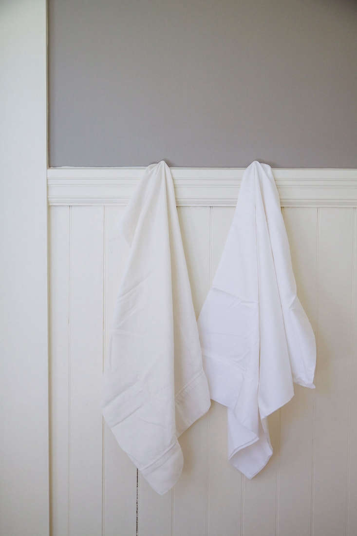 Side-by-side comparison of a yellowed pillowcase and a brightened white pillowcase.