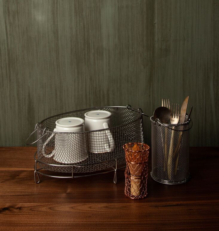 Woven metal countertop containers made of copper and stainless steel.