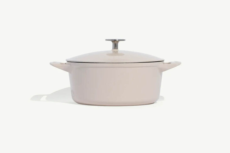 An Antique White Made In Cookware Round Enameled Cast Iron Dutch Oven.