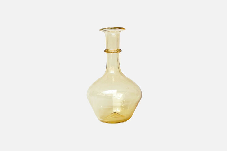 The Il Buco Vita Graduated Pienza Decanter in an amber tint.