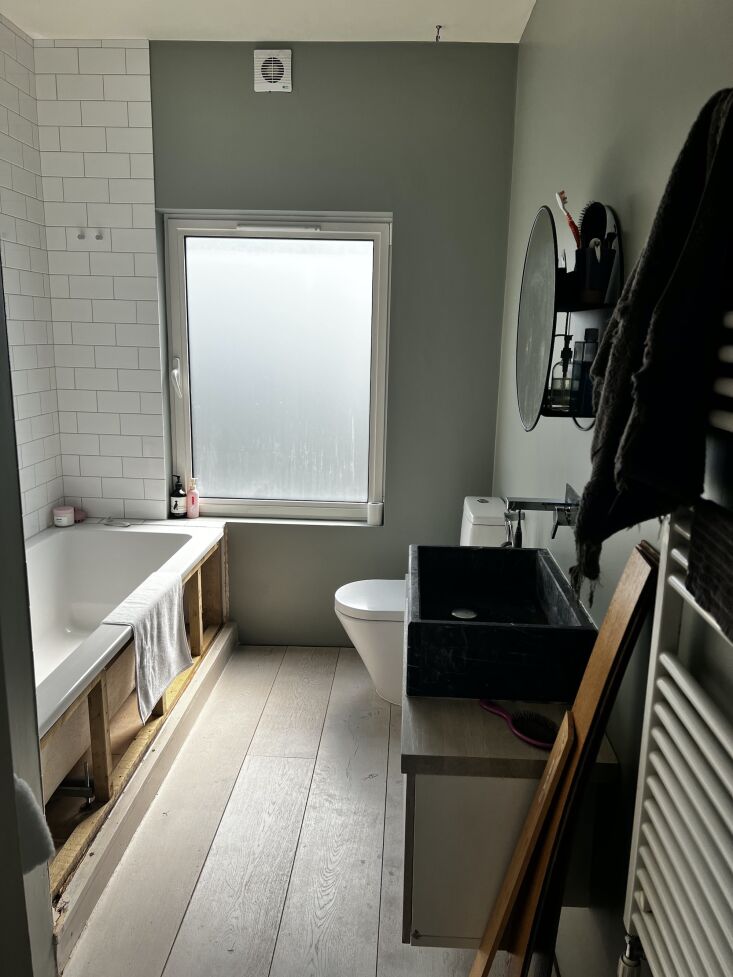 Detail shot of traditional architectural elements and vintage fixtures replacing modern apartment fittings.