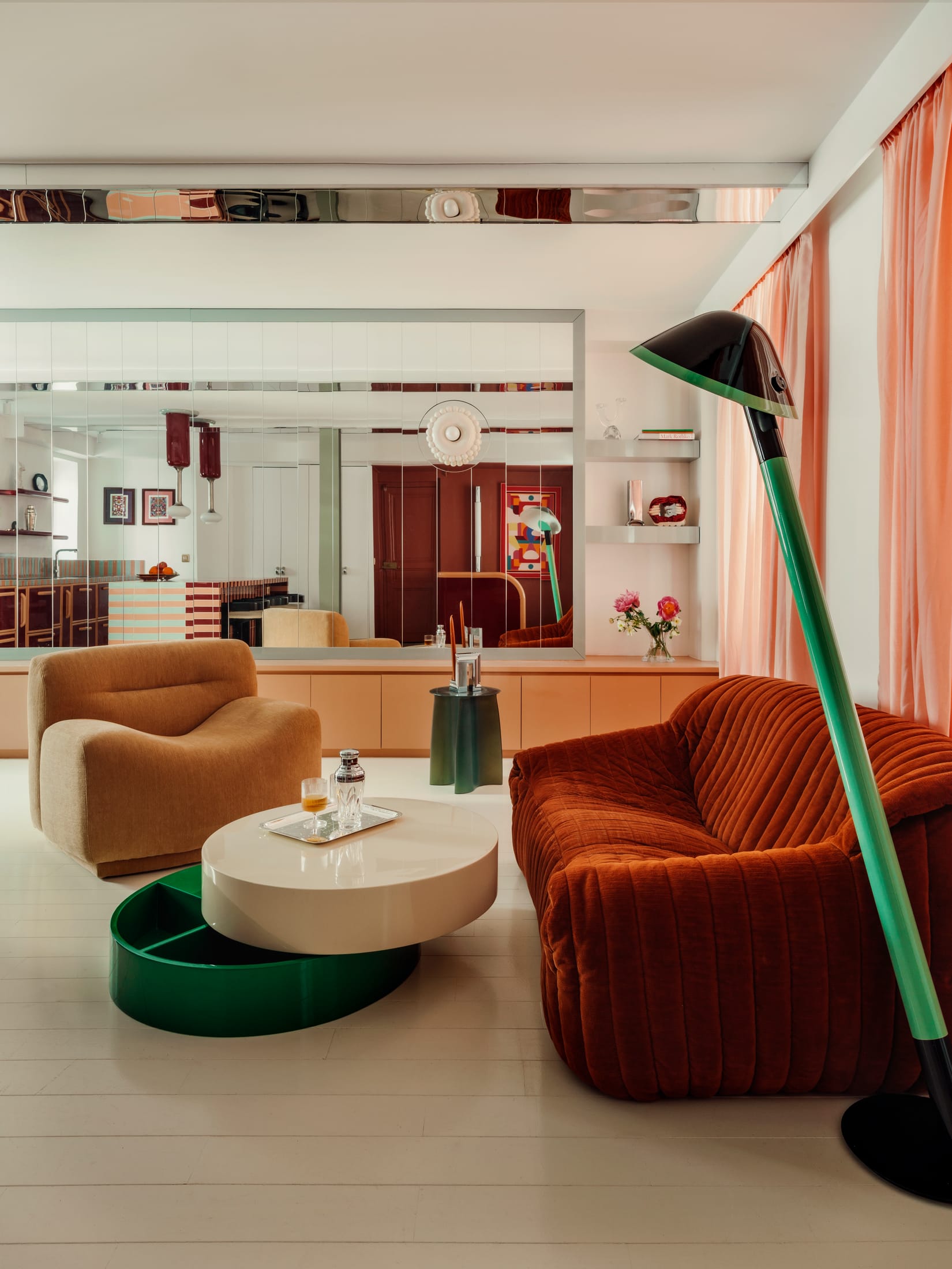 Mirrored surfaces reflecting the living area to create an illusion of depth in a small room.