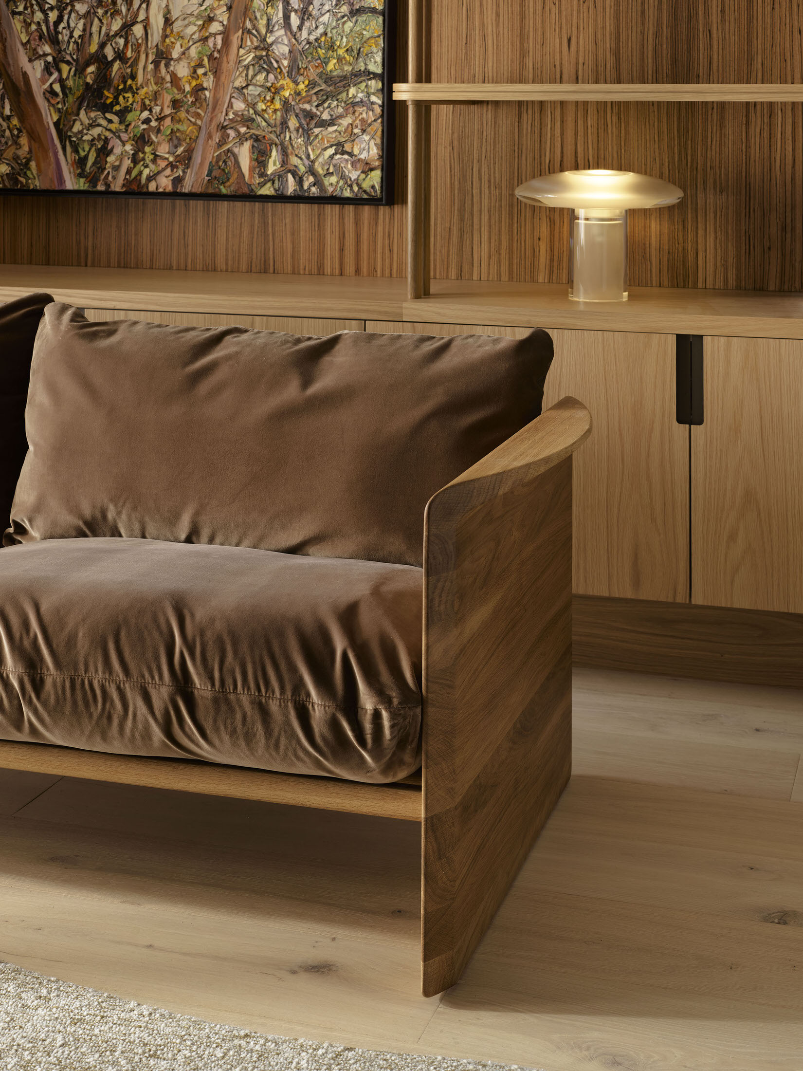 A minimalist timber-framed Cove sofa upholstered in neutral fabric.