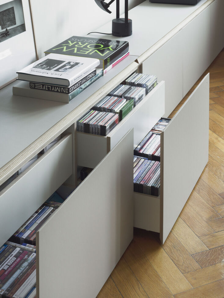 Custom light-wood drawers specifically designed for CD storage.