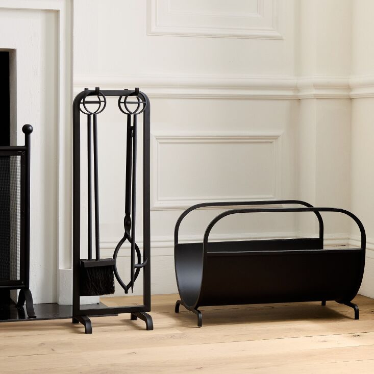 West Elm Modern Lines Fireplace Log Holder with a geometric metal frame.