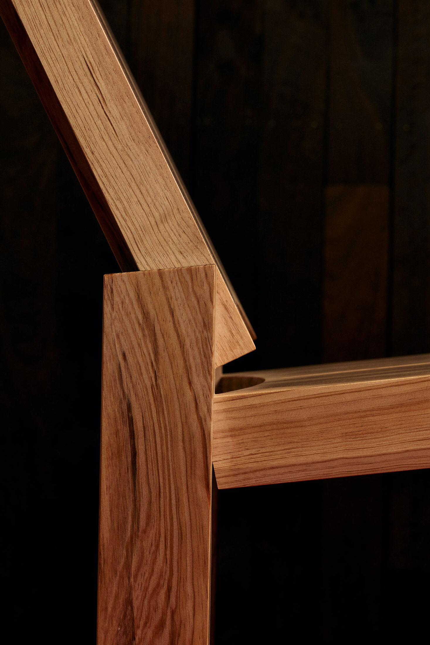 Extreme close-up of the pine timber showing the intricate knots and grain patterns.