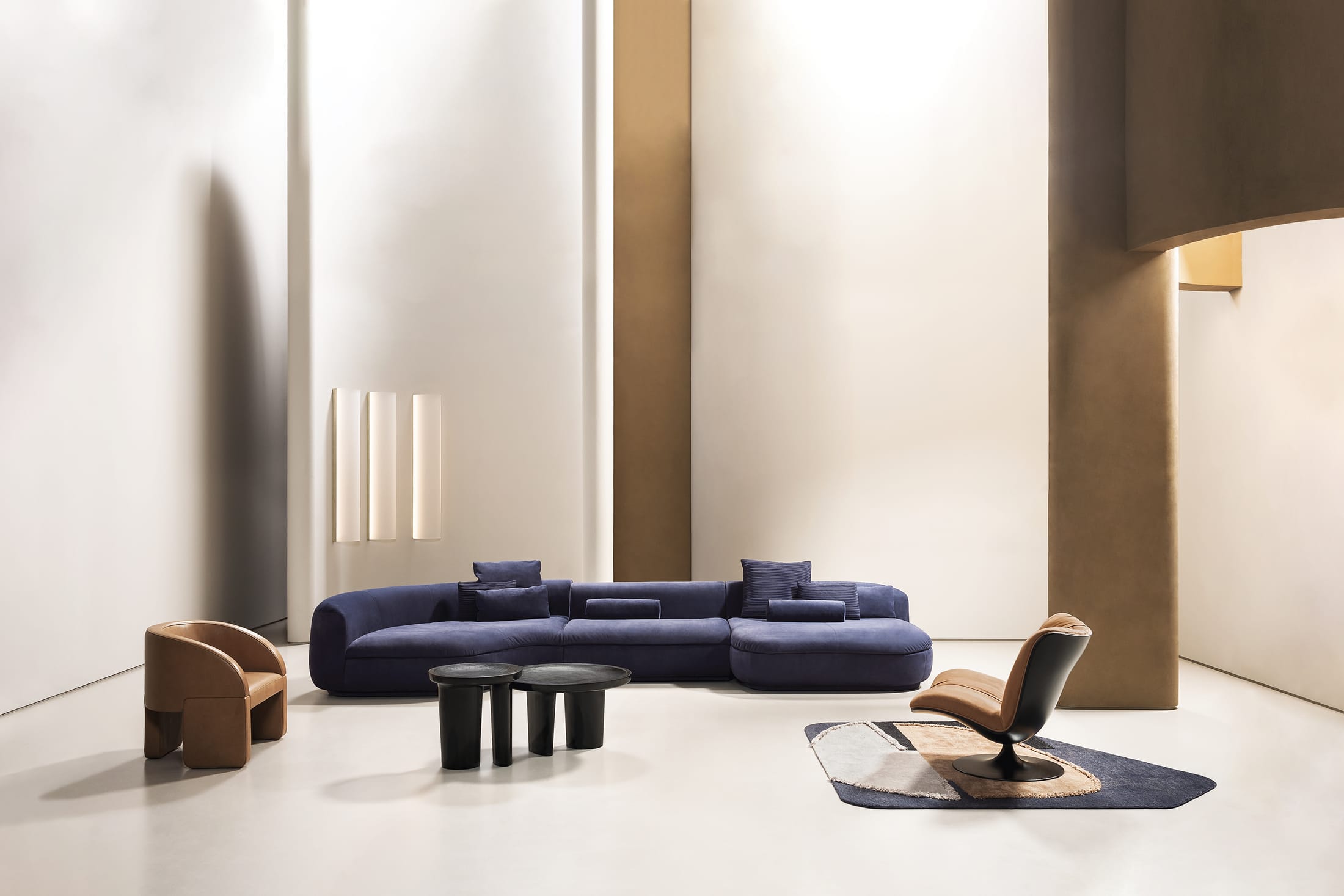 A Baxter Piaf sofa with organic, curved lines in a sophisticated modern interior setting.