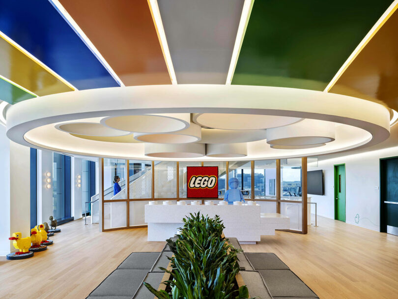 Modern LEGO HQ reception area with a circular ceiling motif and brand signage.