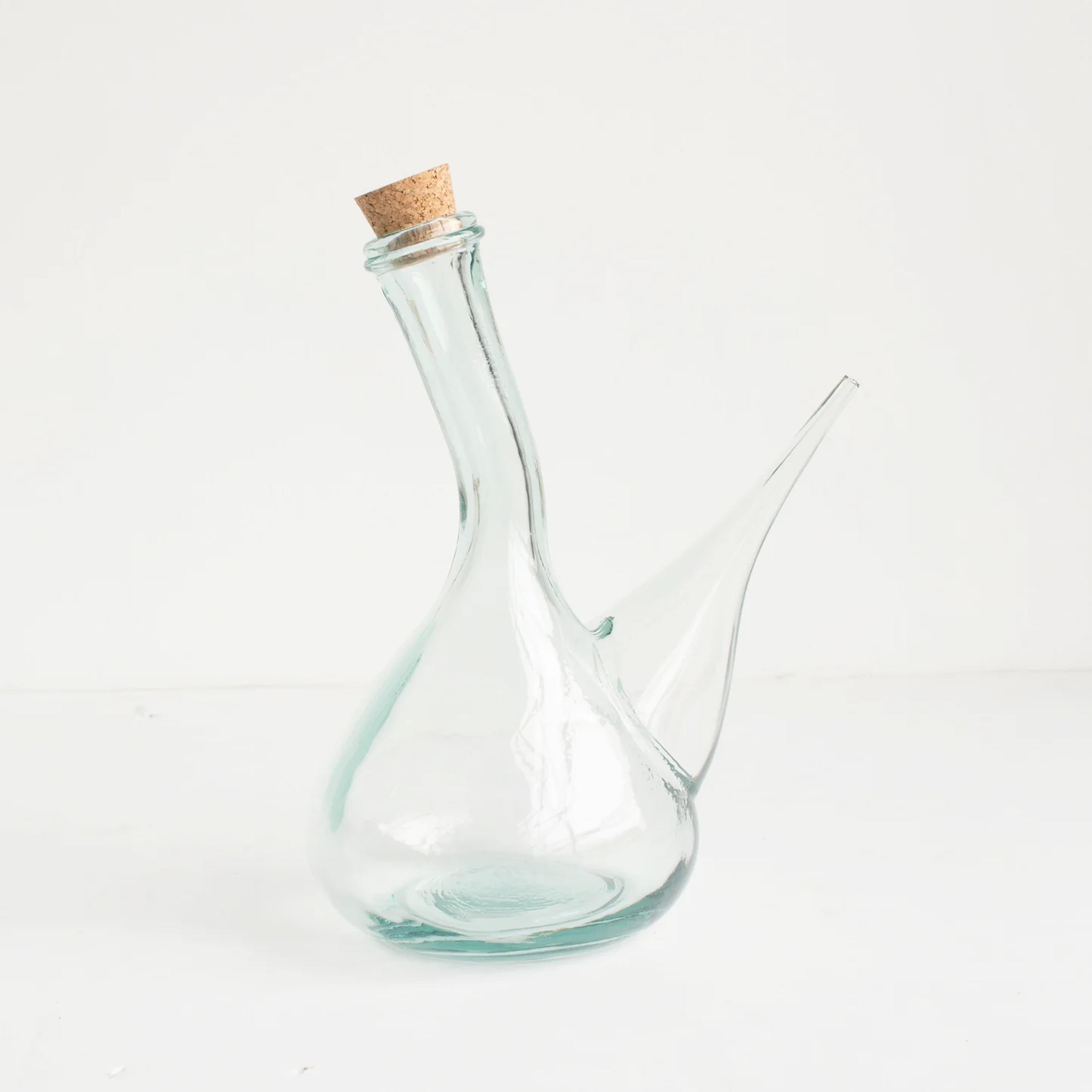 A traditional glass Spanish Porrón wine pitcher.