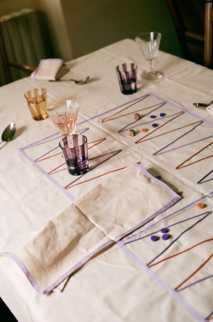 Detailed view of the Agazia Backgammon Tablecloth featuring Roman deadstock fabric.