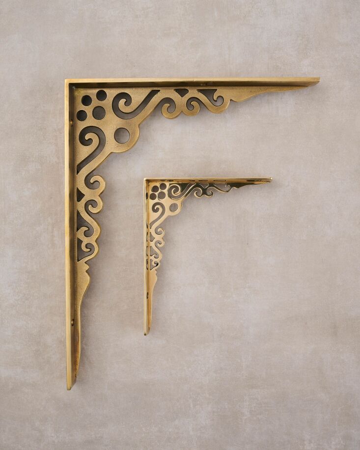 A comparison of large and small brass shelf brackets in various finishes.