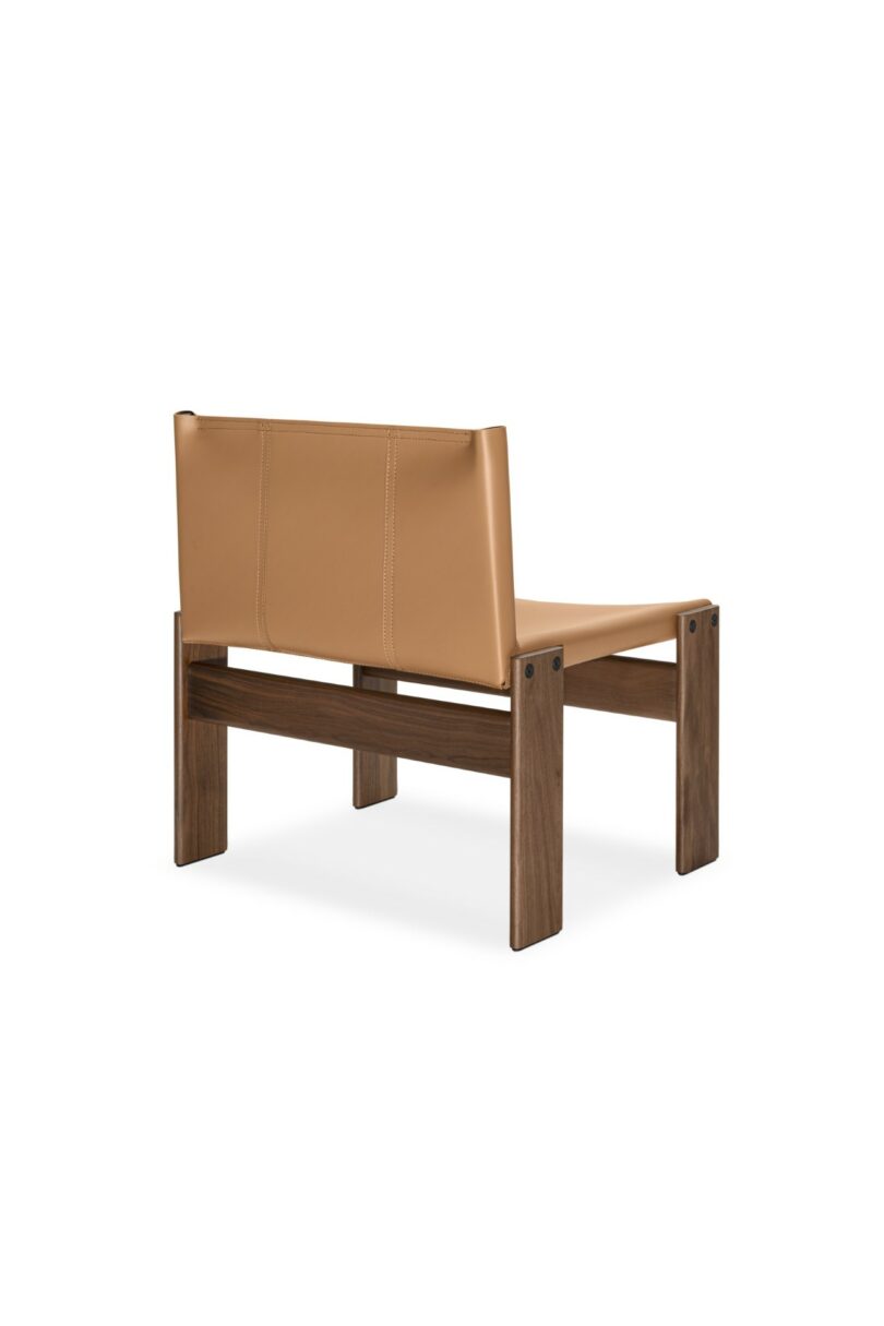Rear view of a modern lounge chair showing the wooden frame and leather backrest attachment.