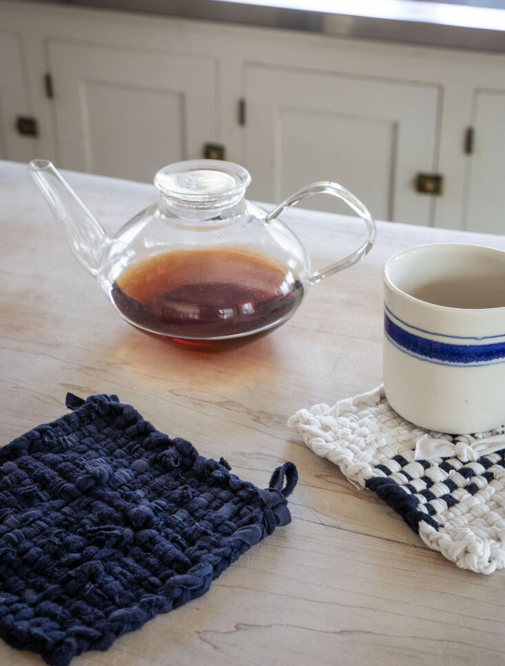 Potholders woven from strips of recycled T-shirt fabric in various colors.