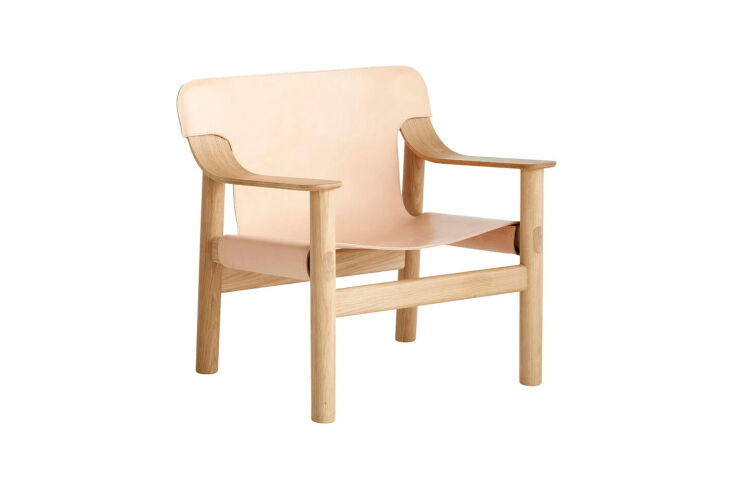 A HAY Bernard Lounge Chair in light oak with a natural leather sling seat.
