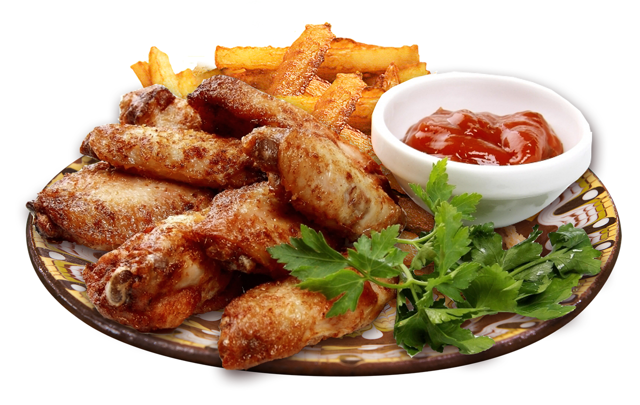 Golden brown crispy chicken wings served on a plate, illustrating air fryer performance.