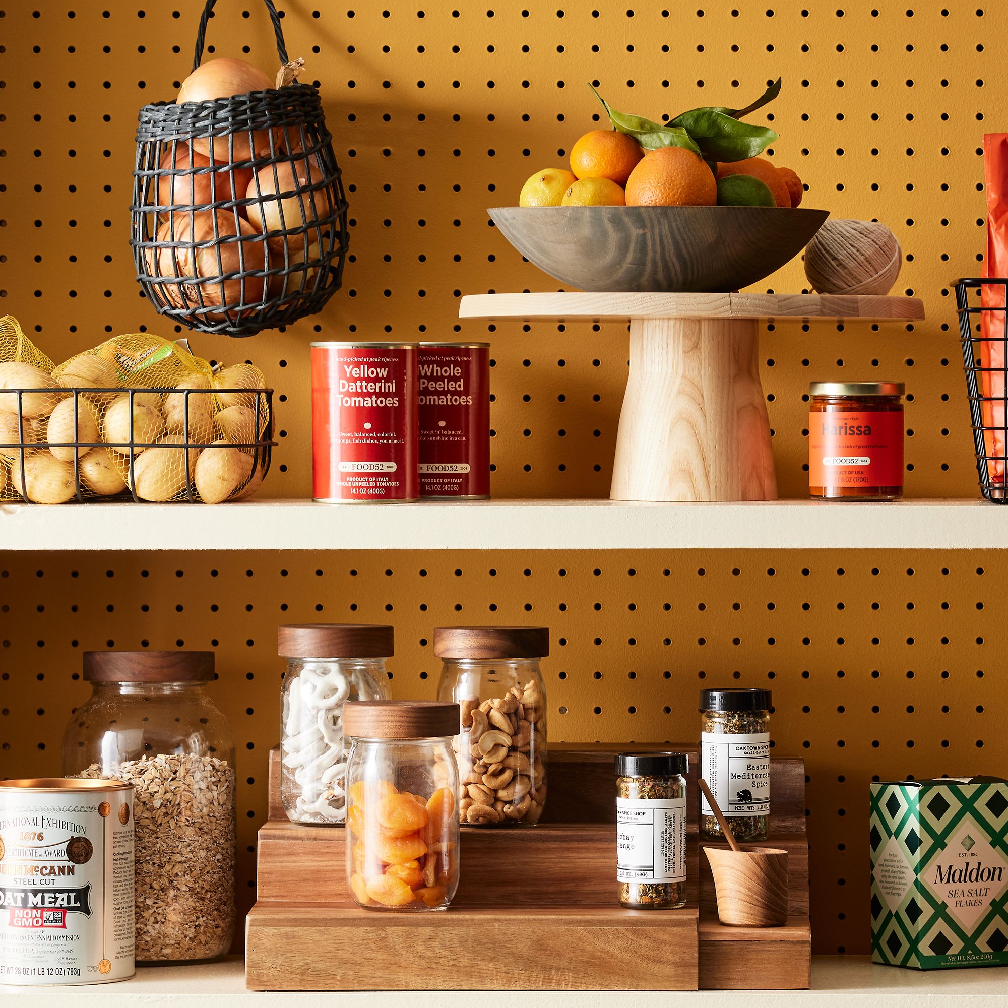 An expert guide visual showing various organized kitchen cabinet sections with labeled storage.