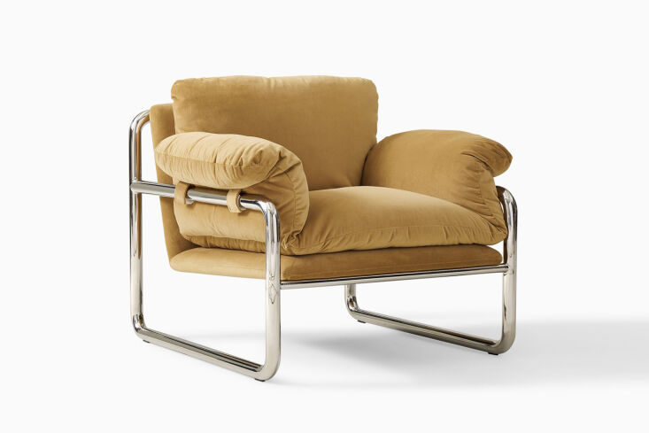 The West Elm Desmond Chair featuring a slouchy olive-colored cushion on a minimalist metal frame.