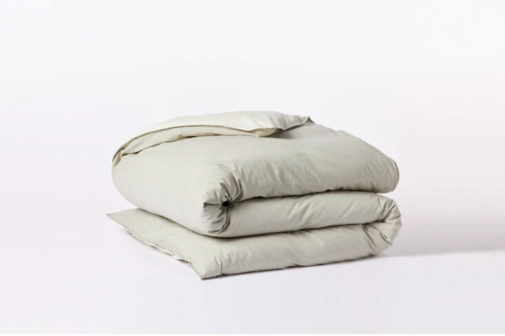 A close-up of an organic crinkled duvet cover in a soft pewter color.