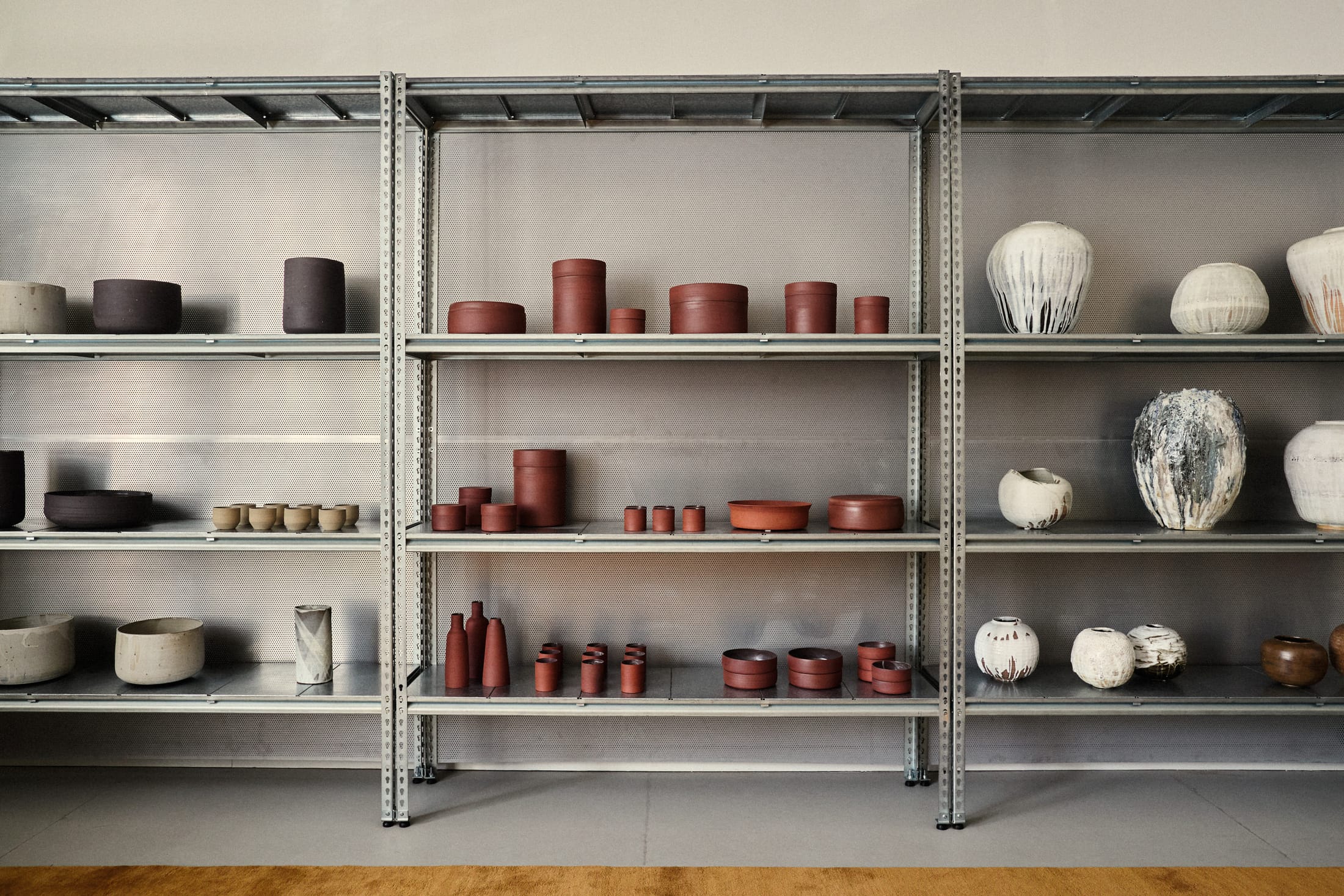 Close-up of ceramic objects and textured surfaces within the studio.