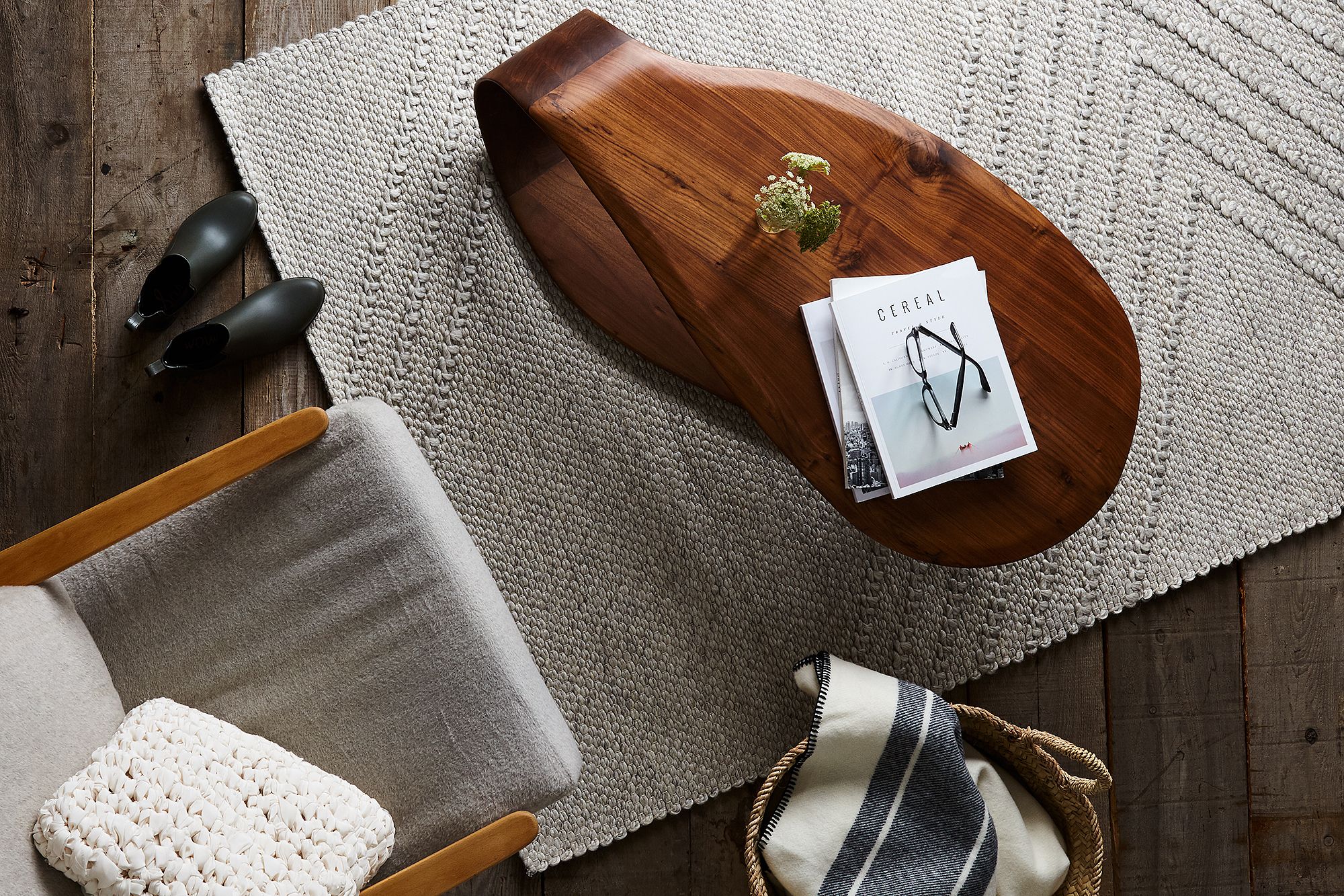 A compact green portable upholstery cleaner designed for removing deep-set pet stains.
