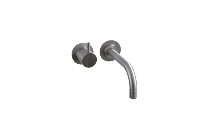 Vola 111AP-16 wall-mounted faucet with a thin, elegant spout.