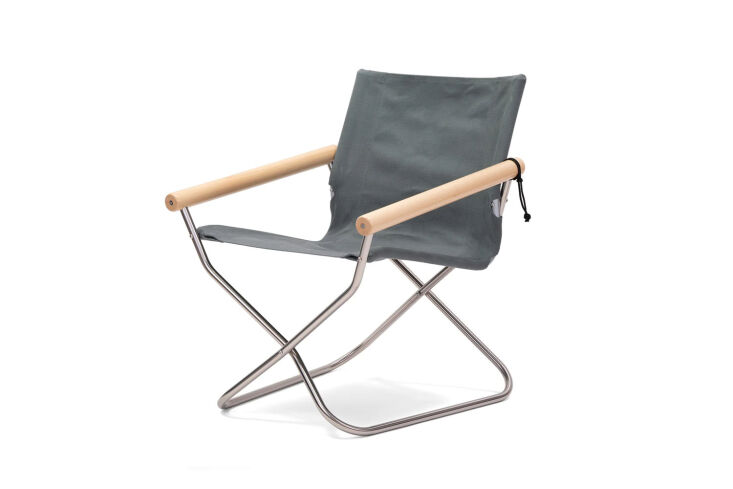Modern gray folding chair with high armrests and a sleek stainless steel frame.