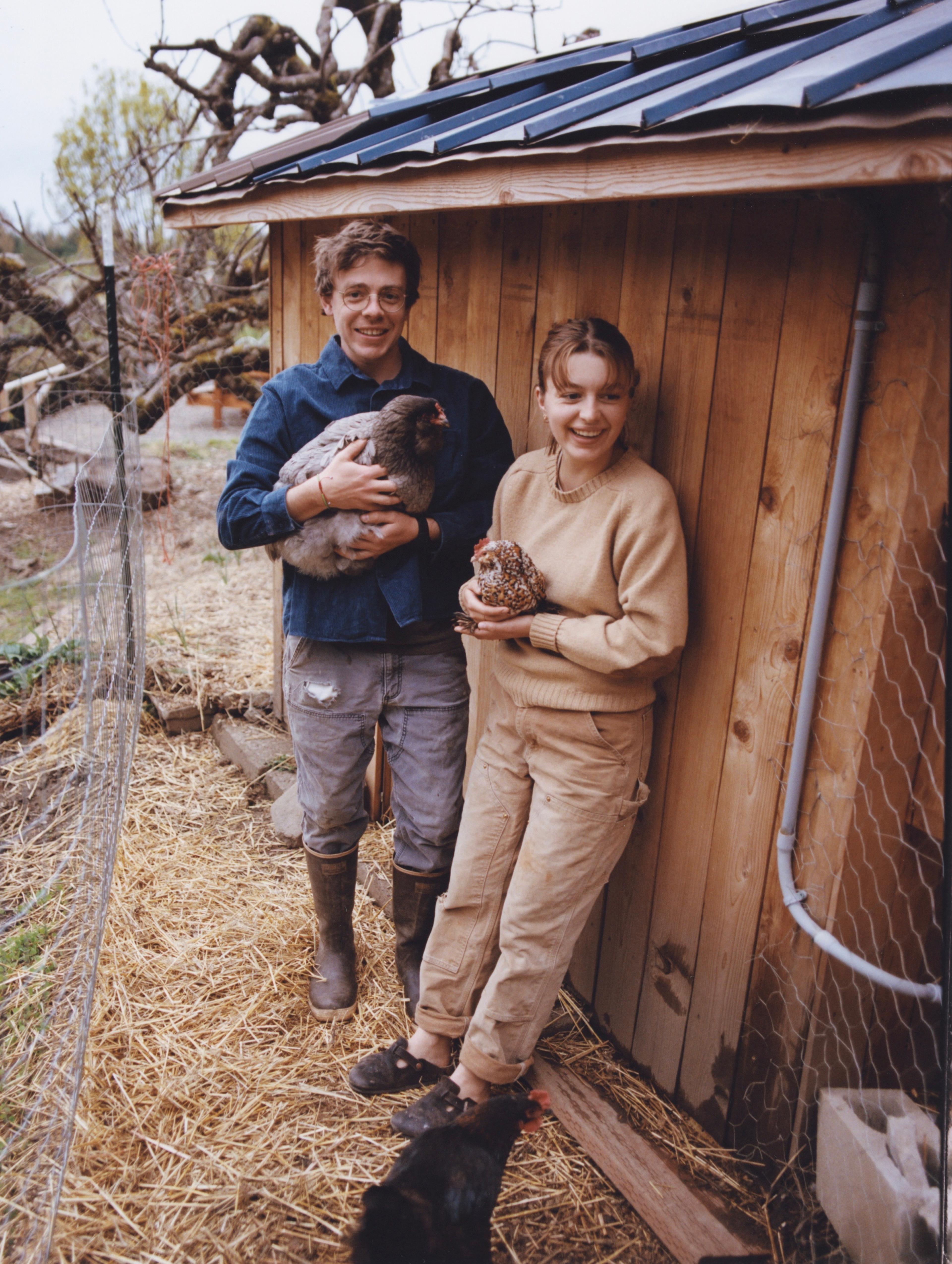 Siblings Mia and Nico Ponzi Hamacher standing inside the renovated Sosta House.