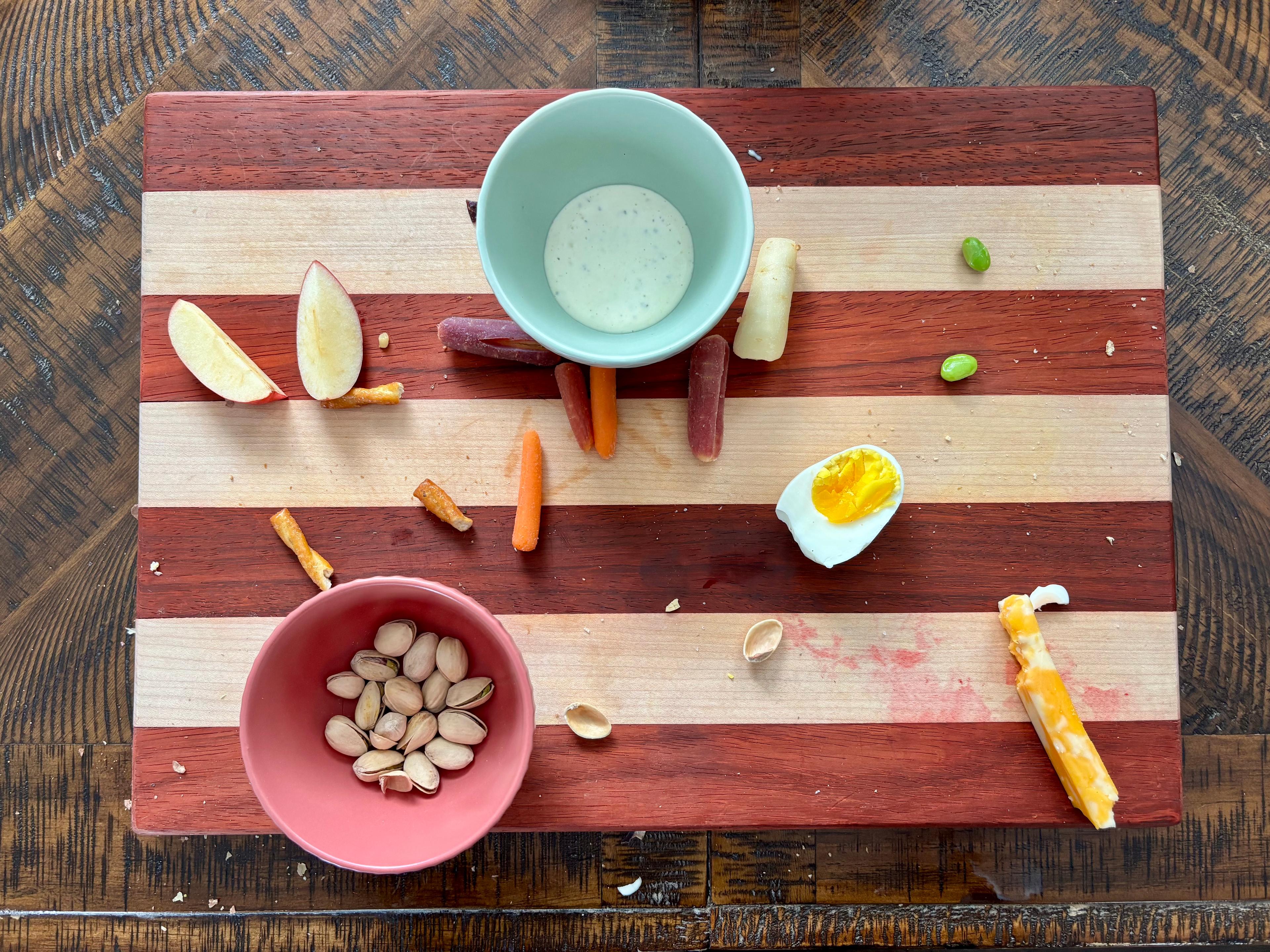 An empty, clean wooden serving board ready for food preparation.