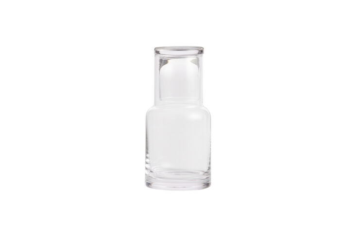 A clear, minimalist glass bedside carafe and cup set from World Market.