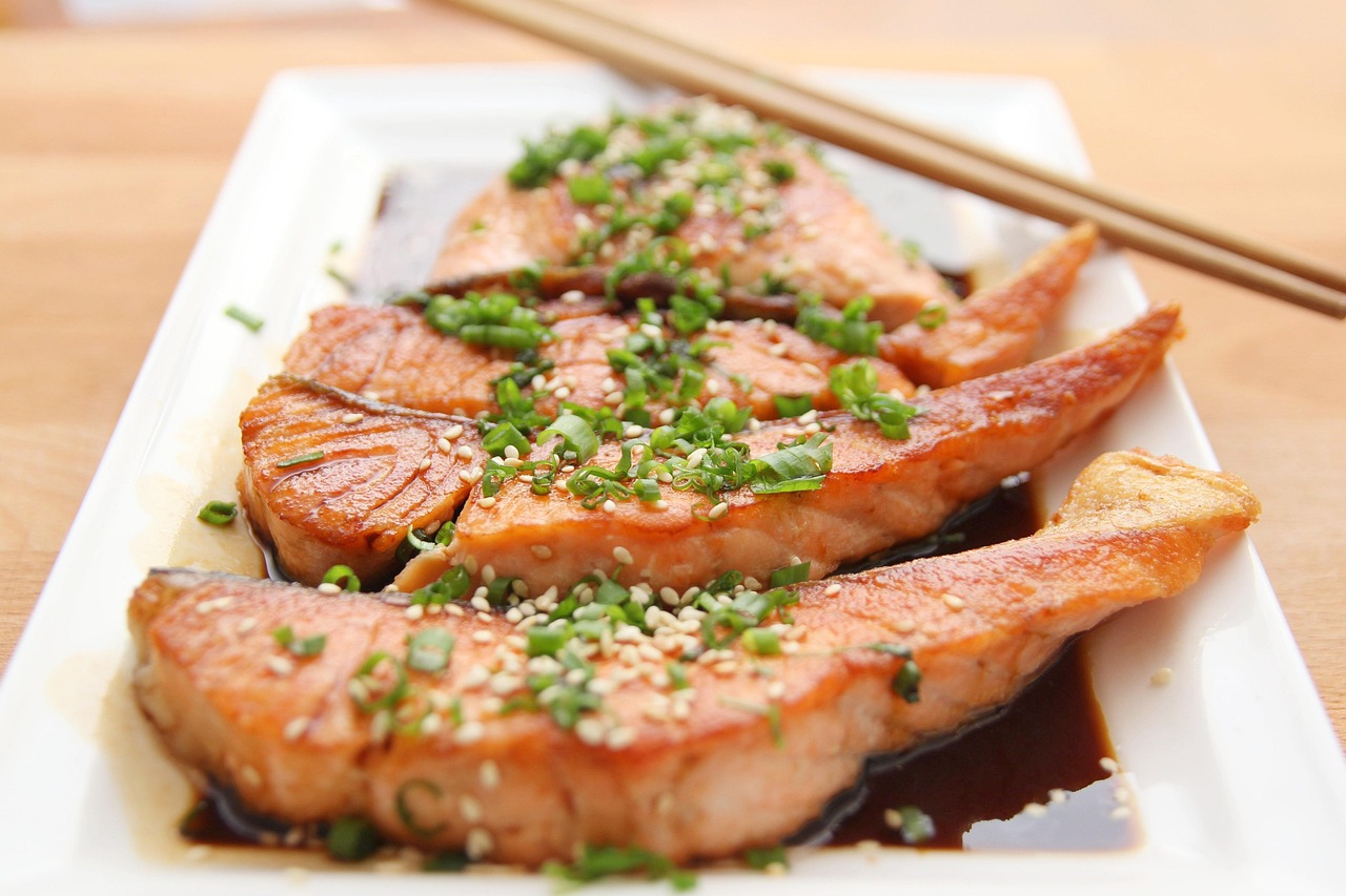 Fresh salmon fillet with herbs inside a vacuum sealed bag