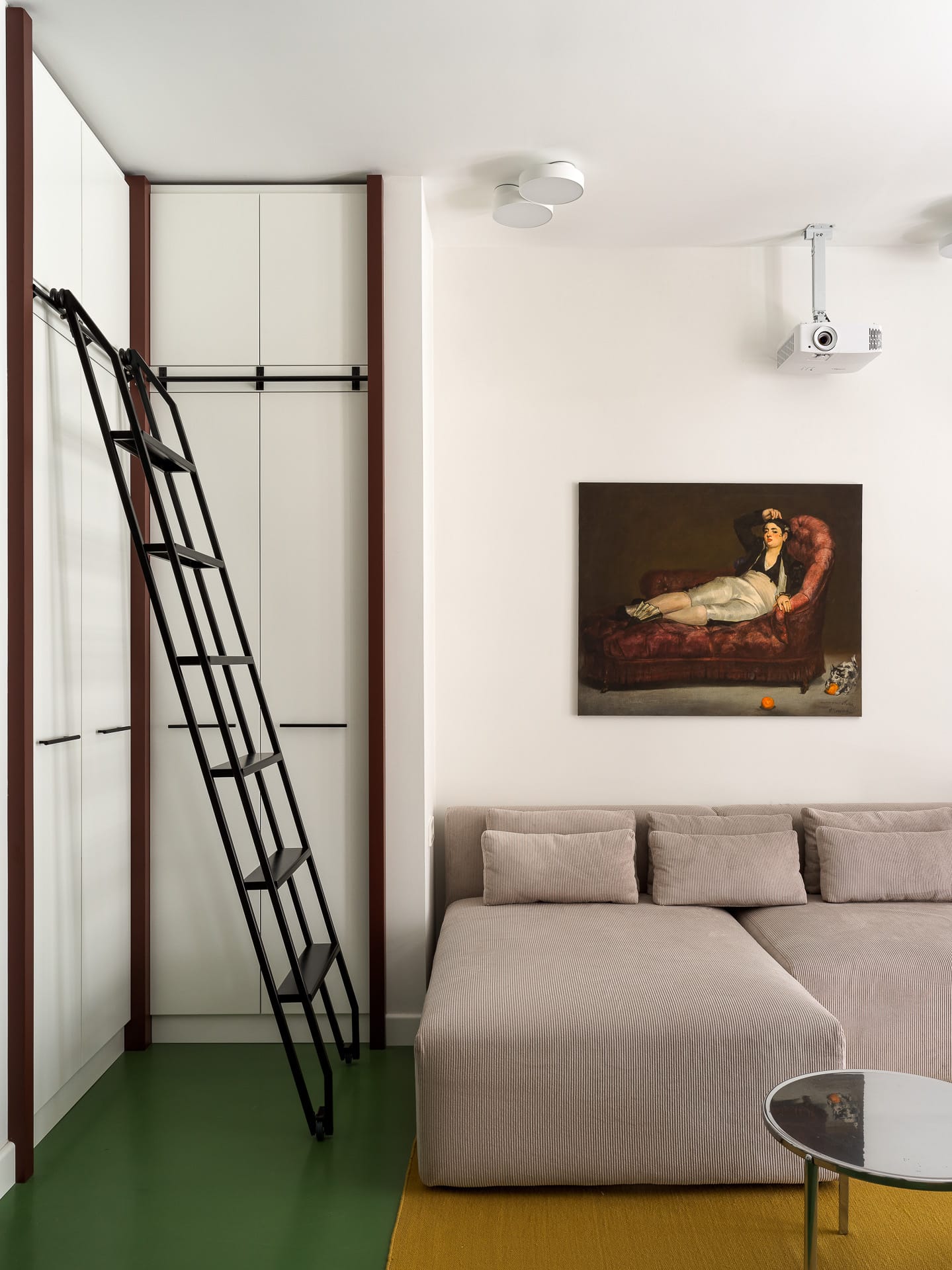 Close-up of neutral-toned walls and floor transitions in a modern apartment.