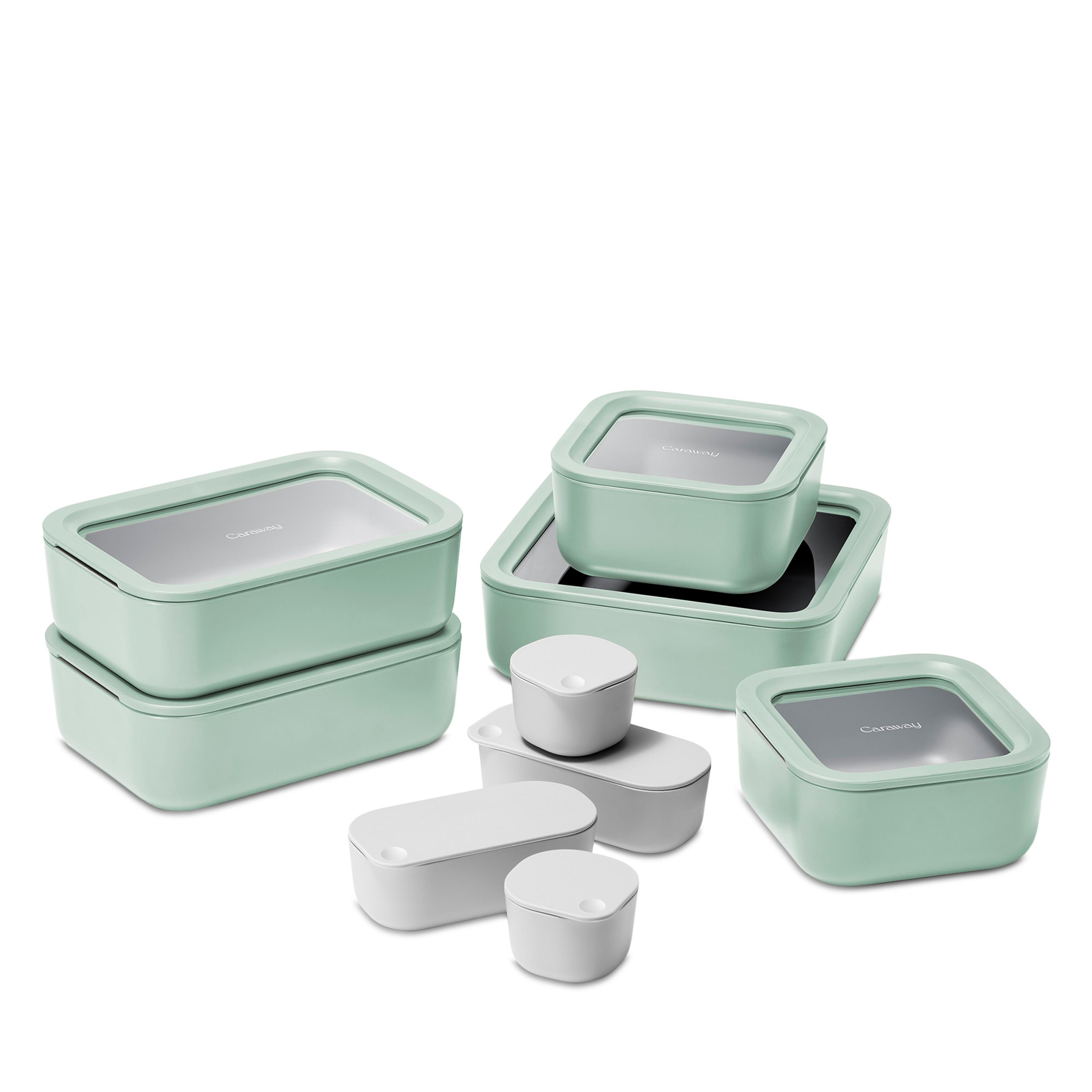 A 14-piece Caraway ceramic-coated glass food storage set organized neatly.