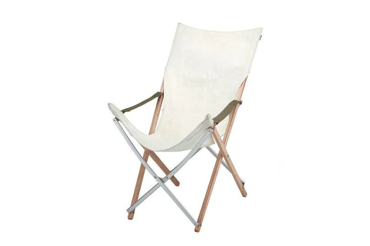 Folding chair with cross-style bamboo legs and white canvas seating.