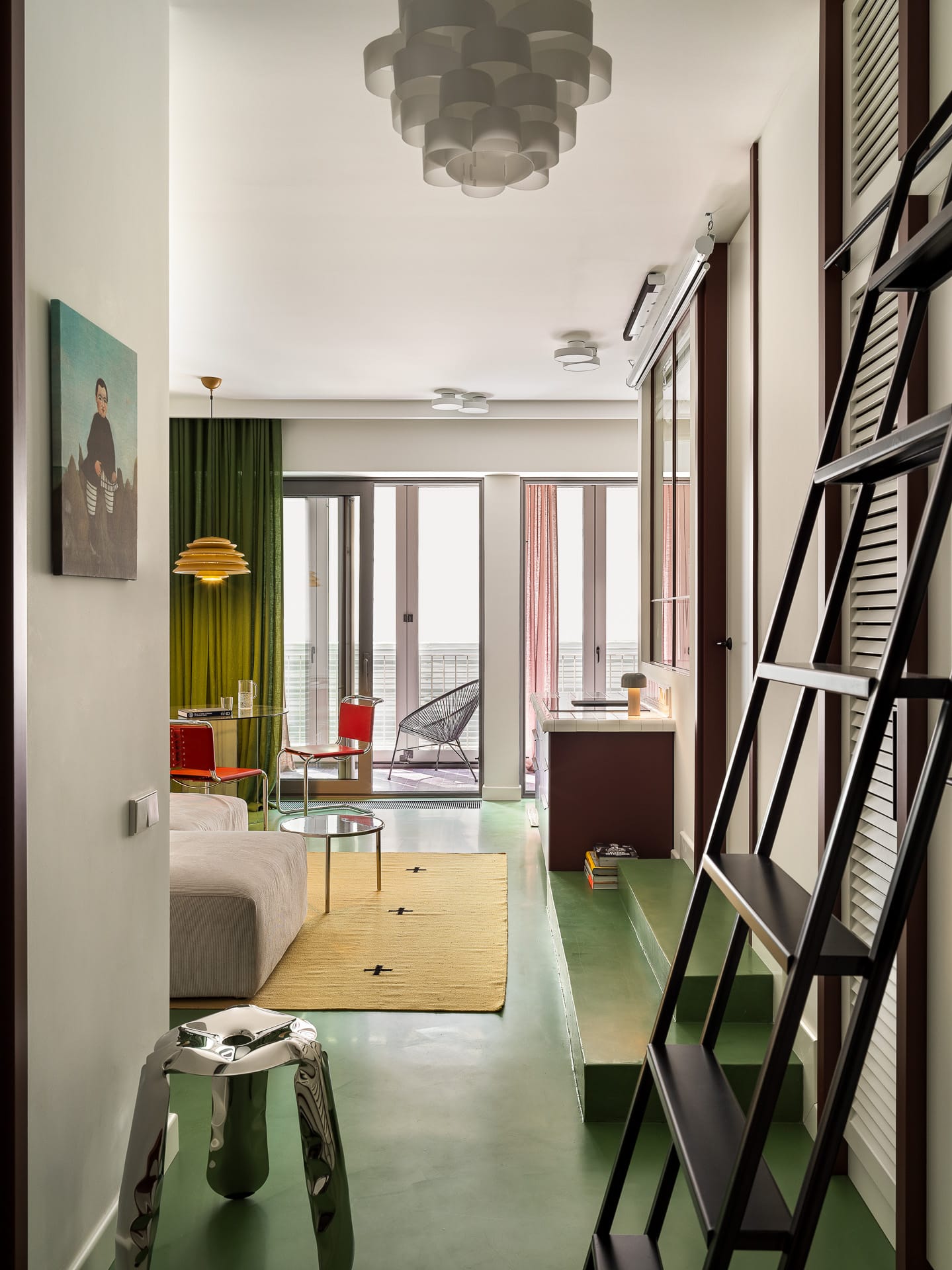 Wide-angle view of a minimalist living area in a compact apartment.