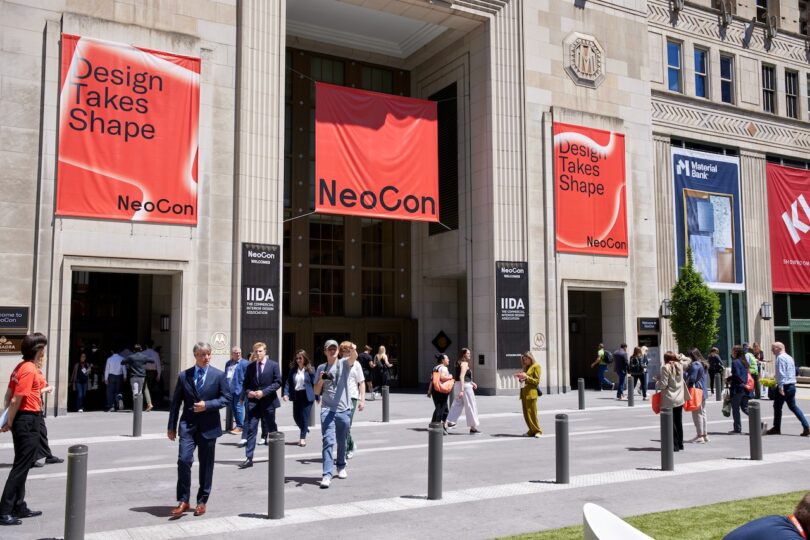 External view of THE MART in Chicago with red NeoCon banners hanging on the facade.