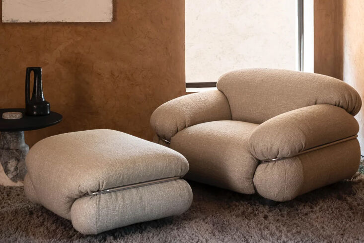 A Sesann Armchair with oversized white upholstery encased in a wrap-around chrome frame.