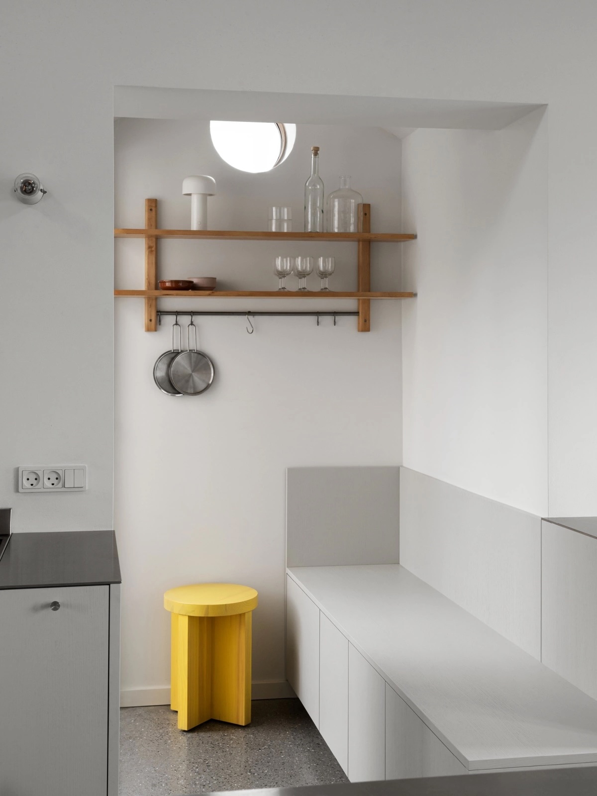 Reform storage benches installed in a minimalist entryway/mudroom.