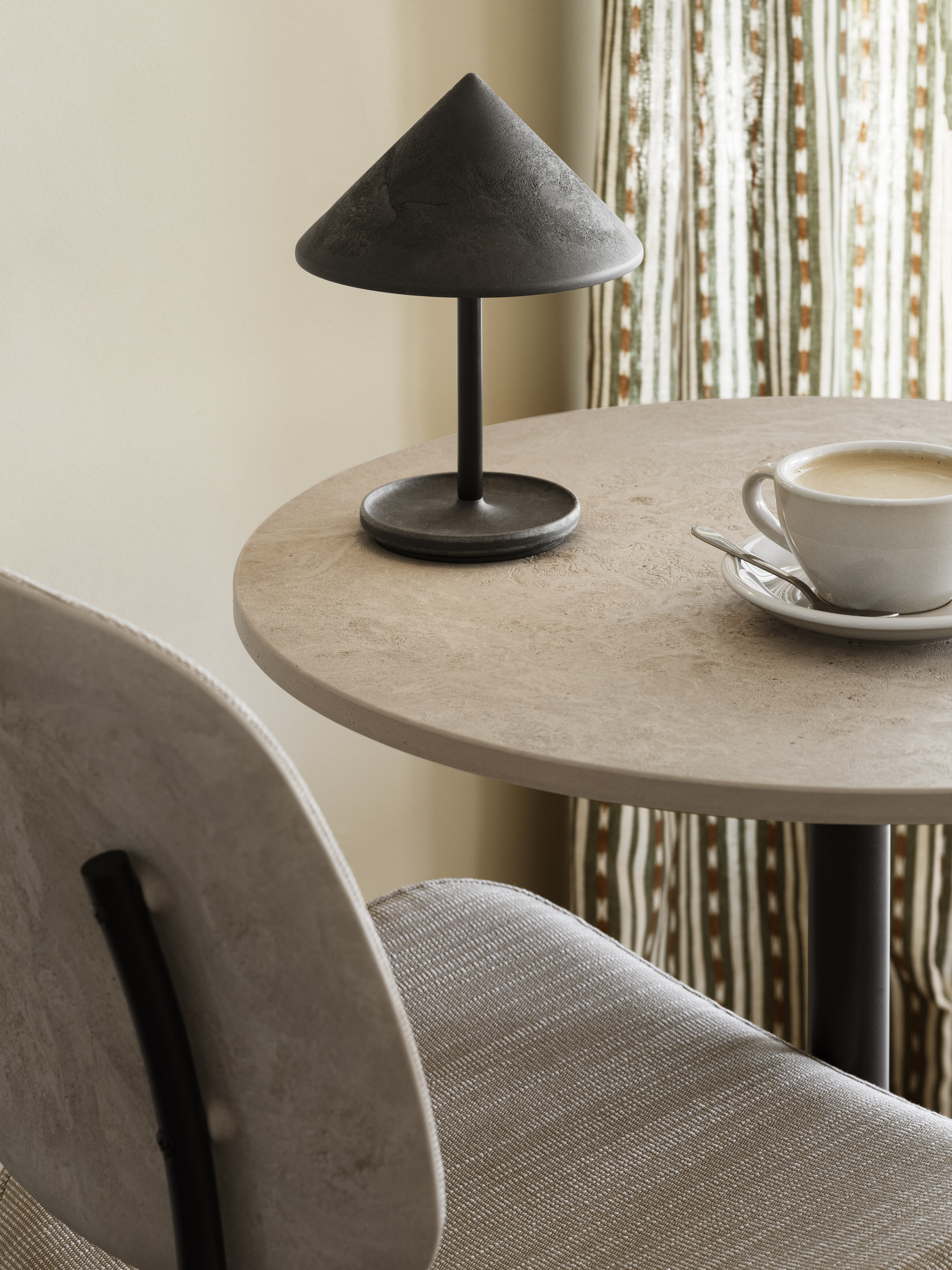A display of Mater Terra pendant lamps and a wall lamp showing the collection's versatility.
