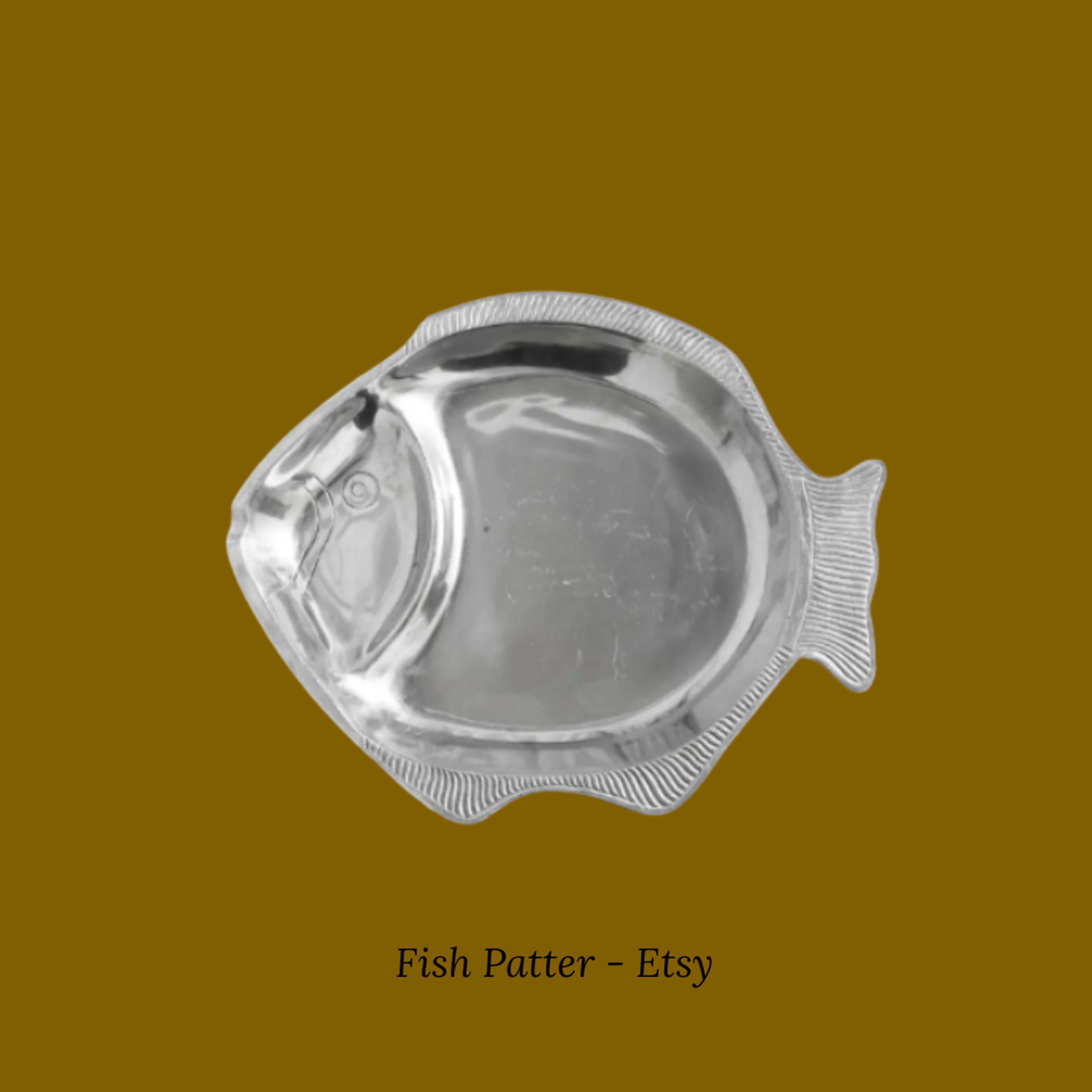A detailed ceramic serving platter shaped like a fish with realistic textures.