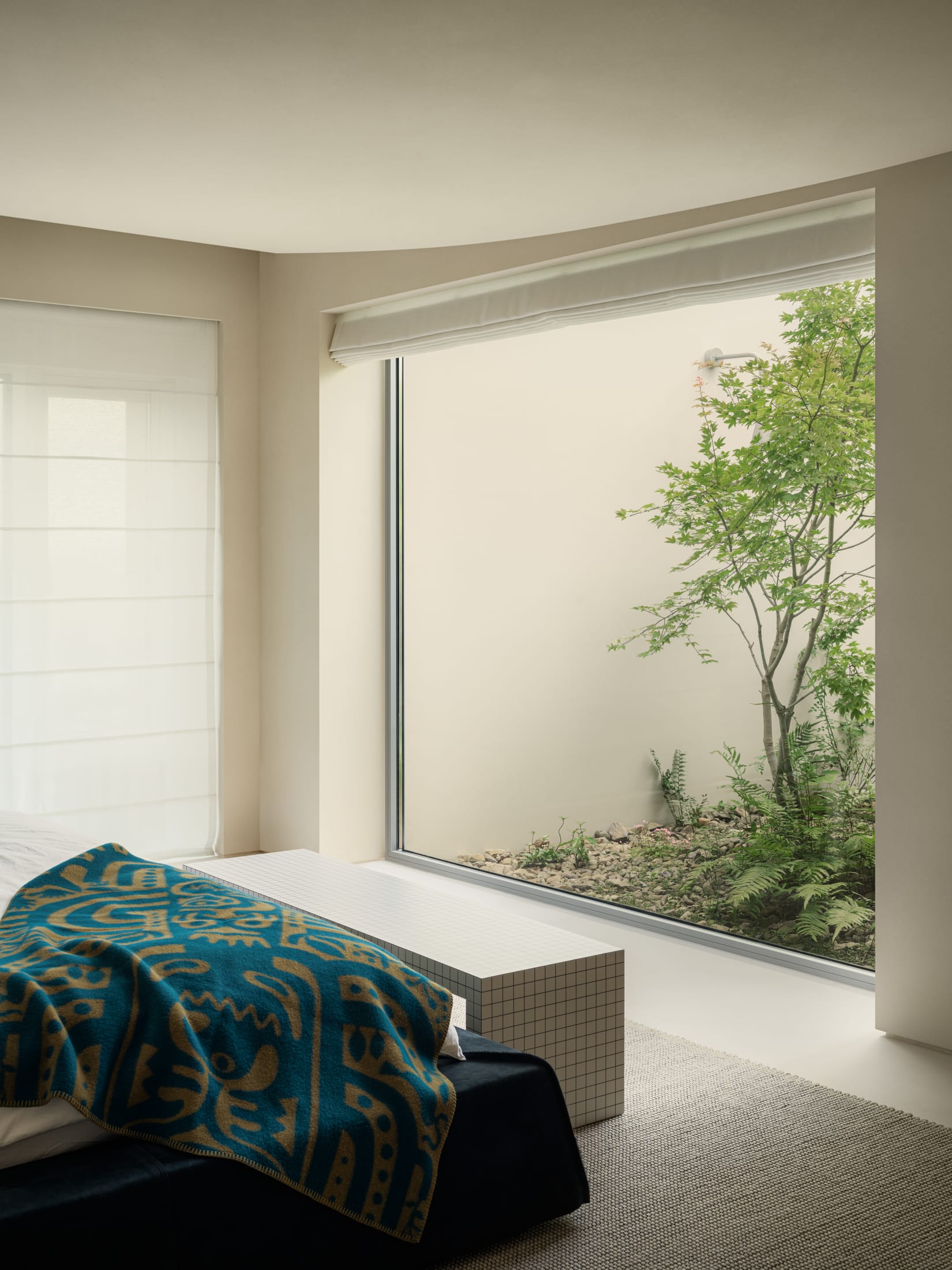 A close-up of dark reddish marble architectural frames contrasting with light-colored walls.