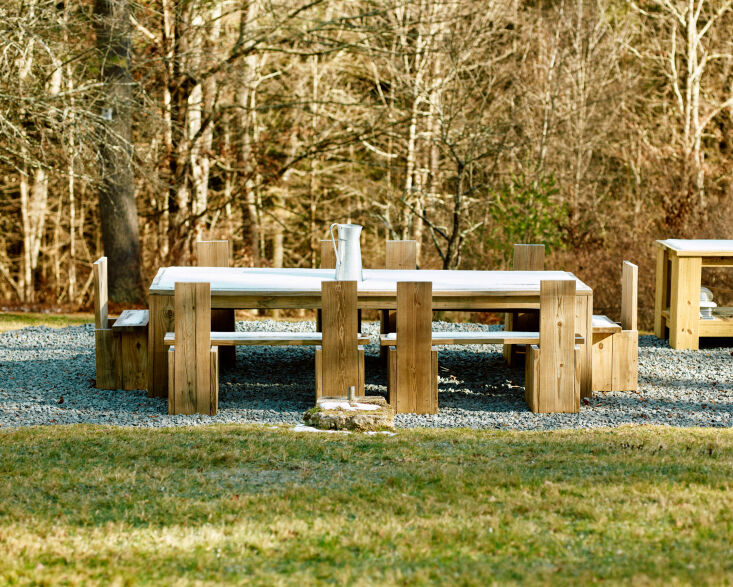 An outdoor dining set made of wood, inspired by Donald Judd's minimalist designs.